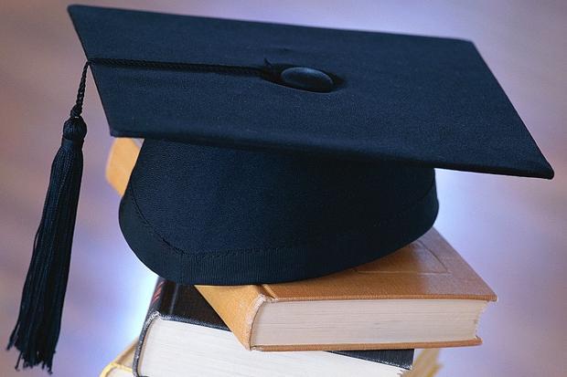  Photo of Graduation Cap on Books