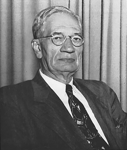 Photo of  Daniel McLaughlin Therrell wearing a suit