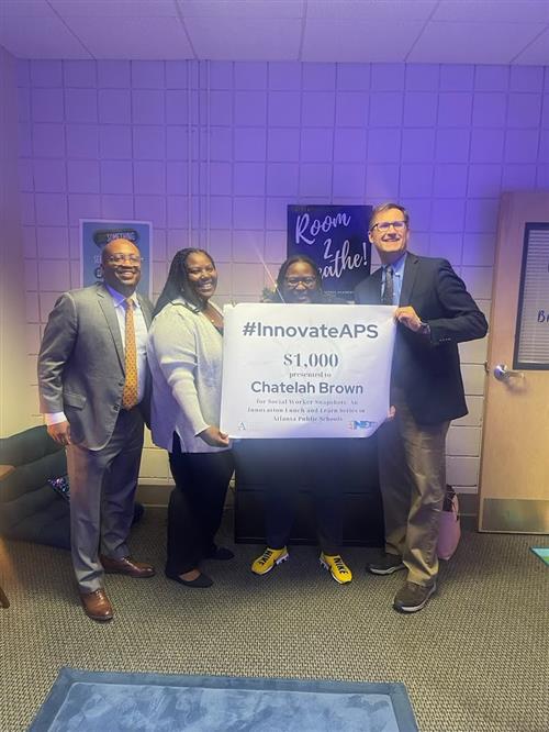 Brown receiving InnovateAPS Award